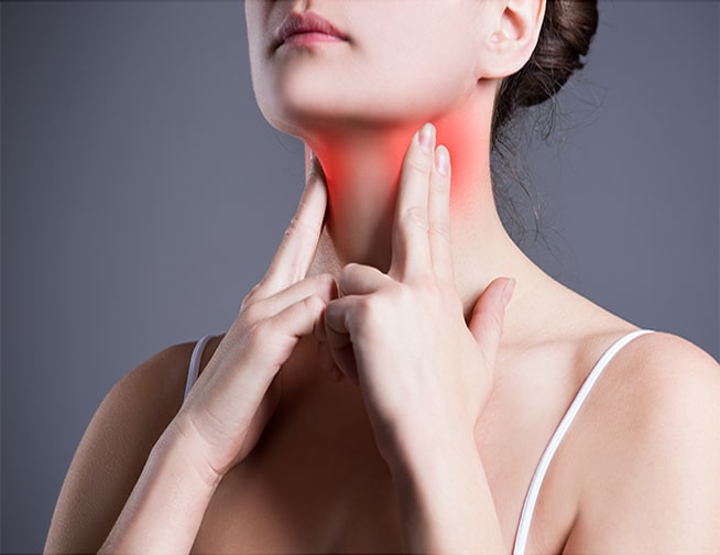 A patient receiving a thyroid evaluation from a healthcare professional at Denton Family Practice Clinic.